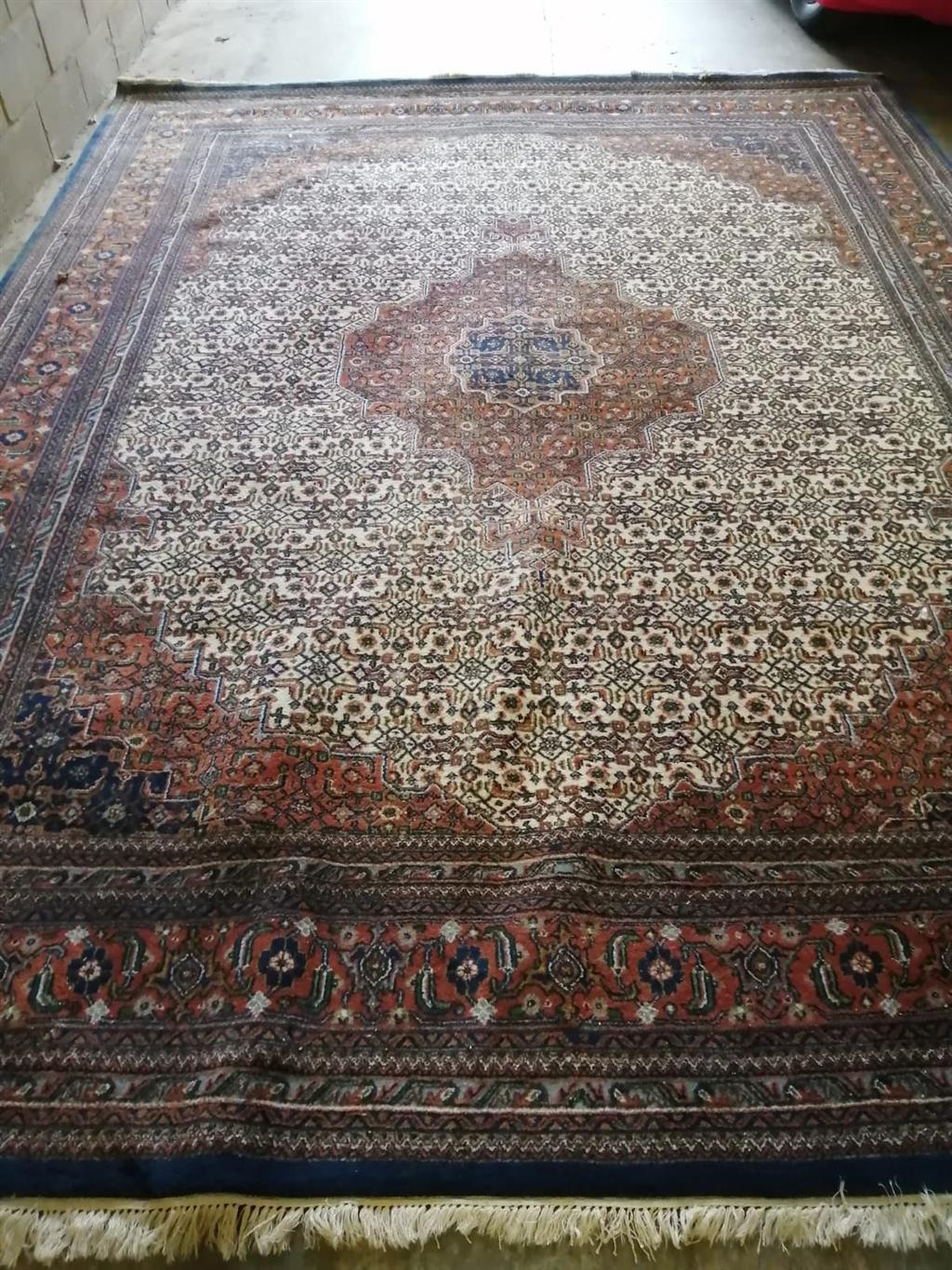 A large Persian carpet, 400 x 300cm